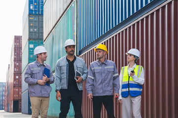 Diverse industrial port workers team meeting in front of stack of cargo shipping containers, Group of professional engineers standing confidently at freight transportation dock