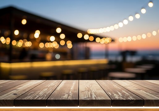 Rustic wooden tabletop extends over a blurred outdoor bar scene bathed in warm, golden evening light.