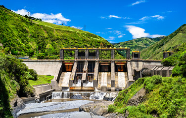Agoyan Hydroelectric Dam stands on Pastaza River near Banos de Agua Santa, Ecuador. Concrete structure generates renewable energy in lush green Andean valley