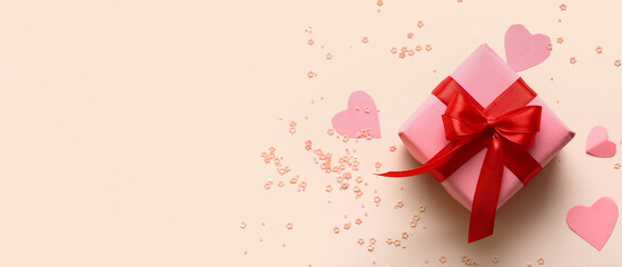 Composition with gift box, paper decor and sequins on color background. Valentine's Day celebration