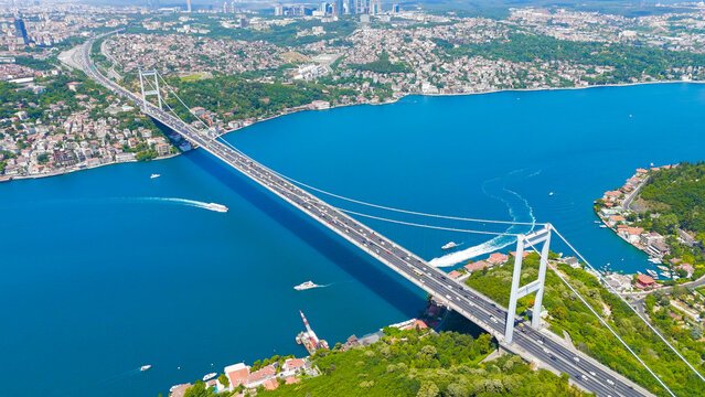 Istanbul, Turkey. Fatih Sultan Mehmet Bridge is a suspension bridge across the Bosphorus Strait, between Europe and Asia. Sunny day, Aerial View