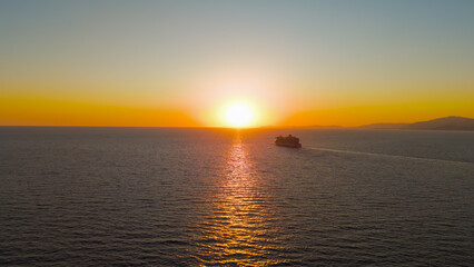 Kusadasi, Turkey. Aerial panoramic view of the coastline during sunset. Golden hour shot capturing the sea, and mountains in the warm evening glow. Aerial View