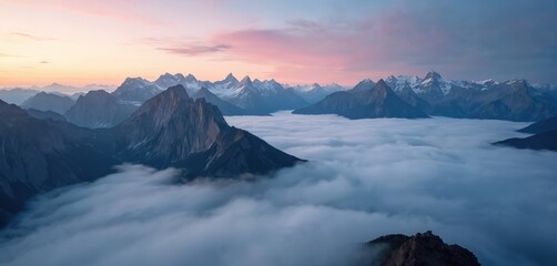 Clouds blanket mountain valley at sunrise. Majestic peaks emerge from misty sea. Pink sky colors light up landscape. Aerial perspective over Santis and Saxer Lucke.
