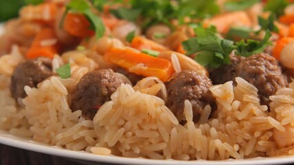 Enjoying a meal with meatballs and rice at a home dinner