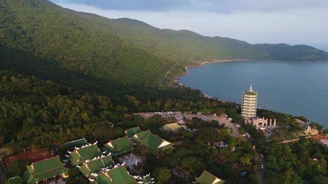 Stunning sunset view of the massive Lady Buddha statue towering over Linh Ung Pagoda on the Son Tra Peninsula in Da Nang, Vietnam