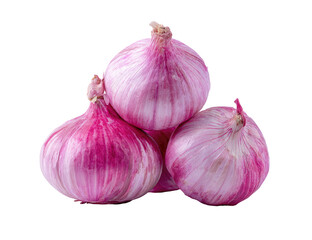 Stacked, raw shallots with pink skin on a black background