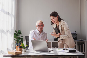 Business colleagues collaborating on project in modern office