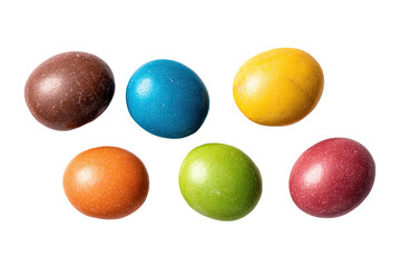 Colorful candy-coated chocolate pieces on black background