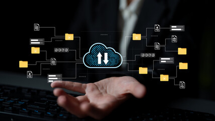 Hand reaching out to a cloud interface displaying upload and download icons, representing digital technology and cloud computing in a business context. Gantry