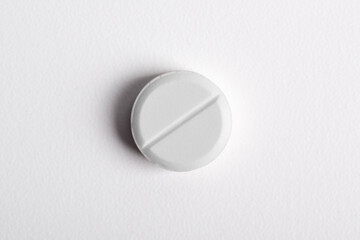 One pill isolated on white background, top view