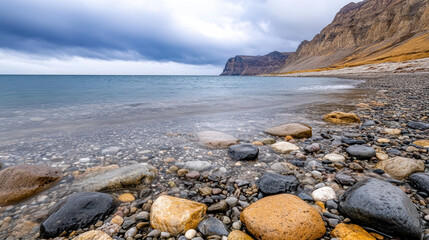 Rocky coast pebble beach ocean stormy sky cliff erosion shoreline wave cloudy seascape