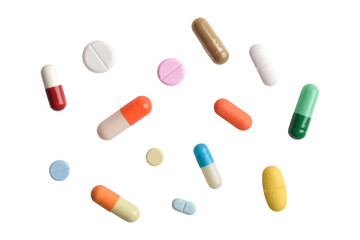 Various colorful pills and capsules on white background, various medicines, vitamins and supplements in healthcare and pharmacy concept.
