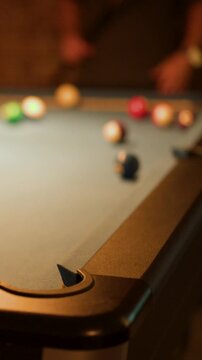 Pool Ball Sinks Into Corner Pocket on Billiard Table