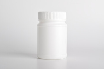 White plastic medicine bottle isolated on white background. Medical and drug concepts.