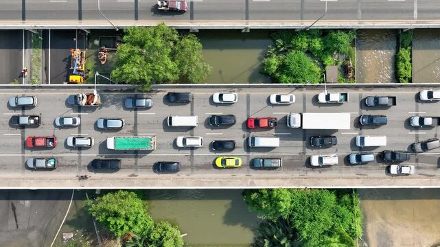 Drone-captured traffic gridlock highlights inefficient infrastructure, peak-hour pressure, fragmented mobility planning, the urgency for data-driven traffic control, and long-term urban development.
