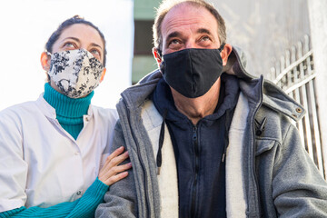Personal assistant nurse supports patient during flu prevention efforts in NHS