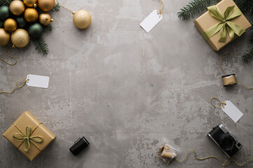 A vibrant Christmas frame of evergreen boughs, red and gold ornaments, pinecones, and plaid ribbon on a knitted background. elegance Christmas frame, and New Year's celebration concepts. copy space