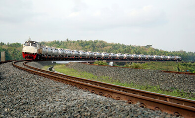 A fast-moving train glides smoothly along the railway tracks, showcasing power, motion, and precision in transportation