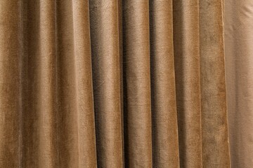 Elegant brown velvet curtains that add luxury and warmth to any space. Ideal for interior design projects, stage backdrops, or product photography, creating an inviting atmosphere.