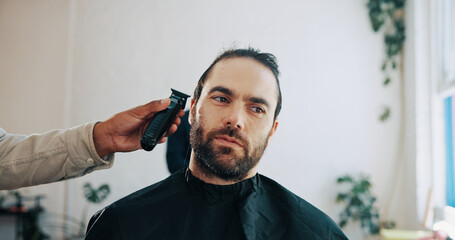Hands, barber and clippers for haircut, trim or thinking for grooming service at small business. People, client and customer experience at barbershop, shaving beard or decision for hairstyle at salon