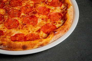 Slices of pepperoni atop melted cheese create a mouthwatering dish that's perfect for sharing