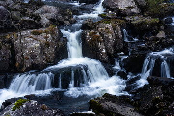 Fototapeta premium Water flowing over rocks on Afon Ogwen in Ogwen Valley