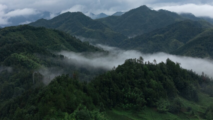 Mountains and villages under the clouds and mist in the early morning of southern Anhui