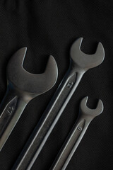 wrenches on black