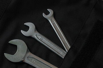 wrenches on black