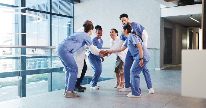 Excited, people and nurses with handstack in hospital for celebration, surgery success and victory. Happy, healthcare workers and huddle for medical milestone, staff motivation and team achievement