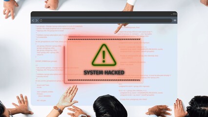A diverse group of professionals gathers around a computer screen displaying a 