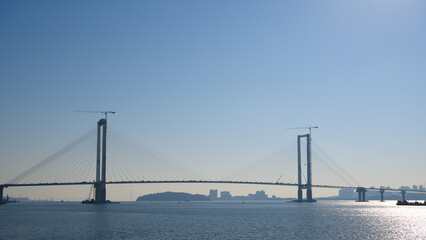 Cheongna-dong, Seo-gu, Incheon, South Korea - November 3, 2025: Construction progress of the Cheongna Sky Bridge. Incheon's Yeongjongdo Third Bridge. The Cheongna Sky Bridge under construction.