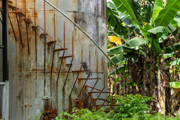 old rusted stairs on a storage tank