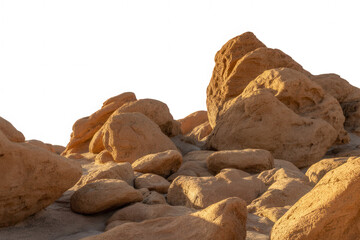 Obraz premium Close up of textured sandstone rock formations in warm sunlight against black background