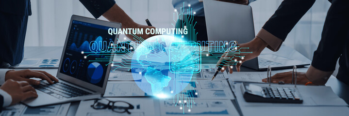 A professional business meeting focusing on quantum computing, showcasing laptops, data charts, and a digital globe in a modern office environment, highlighting innovation and teamwork. Trope
