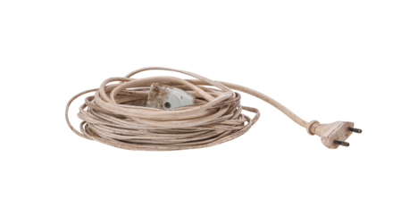 Grungy coiled white electric cord with plug, isolated