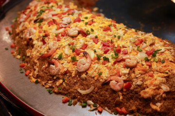 Delicious savory platter of fried rice with shrimp and colorful vegetable. This appetizing main course dish makes great buffet meal for festive party celebration