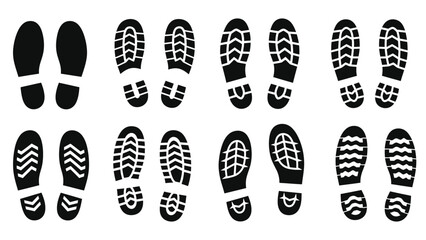 Collection of black shoe soles and footprints arranged in neat rows