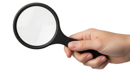 Hand holding a magnifying glass, examining something closely with curiosity and focus