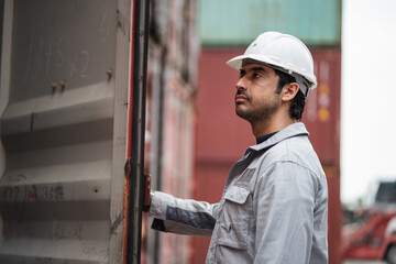 Man logistics workers use tablet computer with container background	