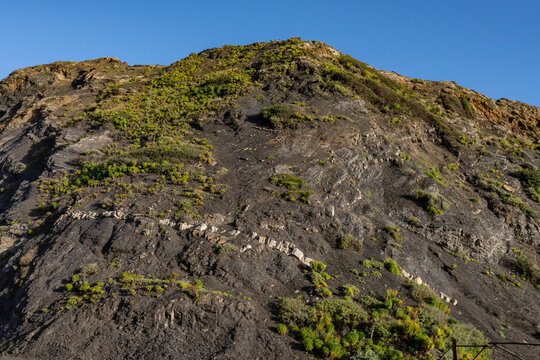 Vaqueros Formation (bedded siltstone, shale and sandstone), with diabase and mafic hypabyssal intrusive rocks of gabbroic and dioritic composition. Point Mugu Rock, Santa Monica Mountains, Ventura 
