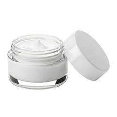 Open glass jar of white cosmetic face cream with glossy lid resting beside it on a transparent background