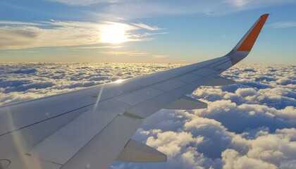 Obraz premium Golden hour flight above fluffy clouds, sunlit sky, and tranquil horizon from an airplane window view, serene travel journey