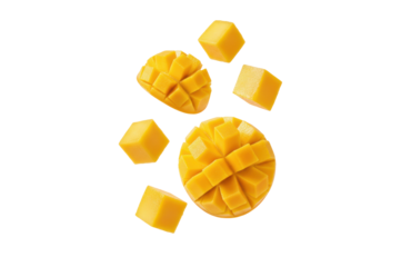 Falling fresh yellow mango cubes and half isolated on a transparent background