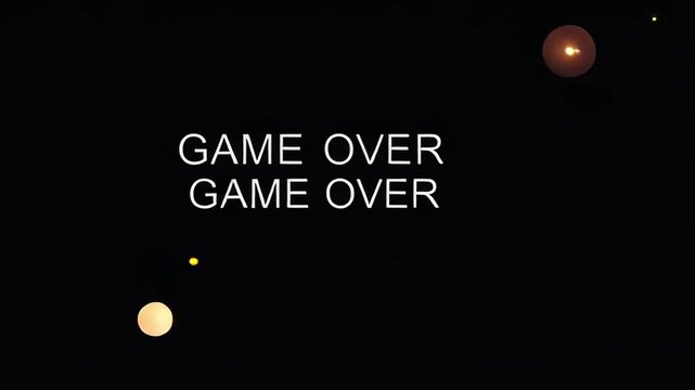 Retro "Game Over" text on a black screen. Classic video game animation with colorful particles. Failure and loss concept