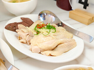 Chicken boiled sliced in a white dish. High protein. Delicious food.