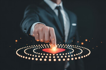 Business man in formal suit pointing finger to virtual heart icon surrounded by glowing dots love connection concept