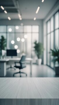 Empty modern office interior with blurred background and foreground focus on wooden table