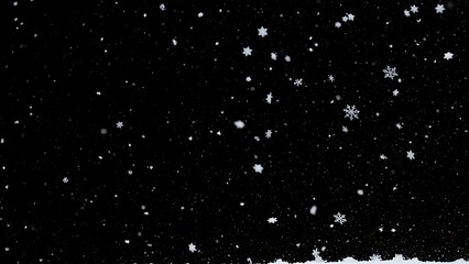 Falling white snowflakes with small snow mound against solid black background