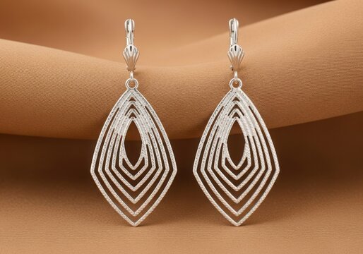 Elegant silver dangle earrings with geometric diamond shape